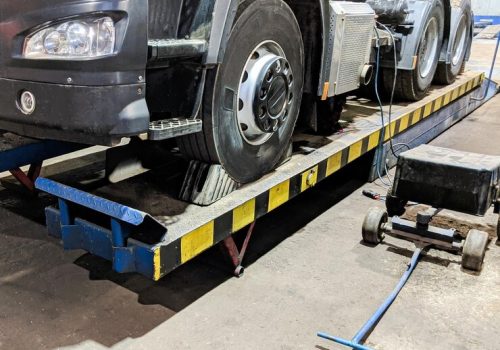 hydraulic-platform-lift-cargo-truck-maintenance-car-repair-service_639996-124